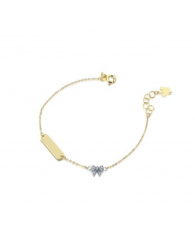 BRACCIALE CON TARGHETTA E ANGELO CHARM IN ORO GIALLO, FIOCCO IN ORO BIANCO CON ZIRCONI BIANCHI